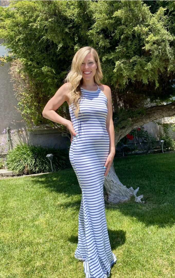 Woman in blue and white striped maxi dress.